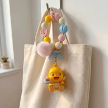 Miniso 奈龙官方黄色恐龙钥匙扣可爱粉色帽子3D动漫人物吊坠卡哇伊粉彩串珠挂绳毛绒球蓝色蝴蝶结包包挂饰背包配件汽车钥匙扣浪漫节日礼物 - 樣式4 - 查看 4
