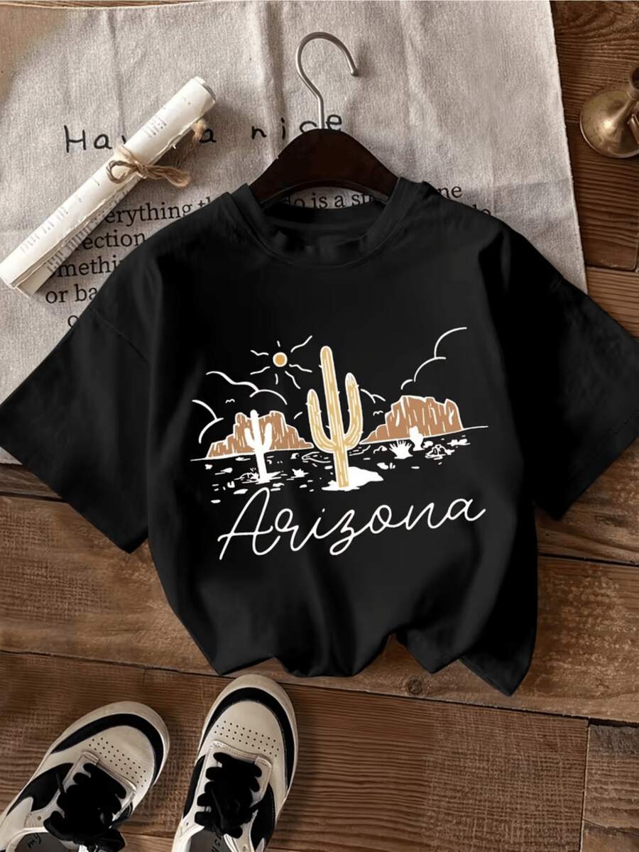 Desert Landscape With Bright Sun, Tall Cacti, And Golden Mountains Evoking The Warmth And Adventure Of The American Southwest. Comfortable Casual Women's T-Shirt For Summer And Everyday Wear. - 黑色 - 查看 1