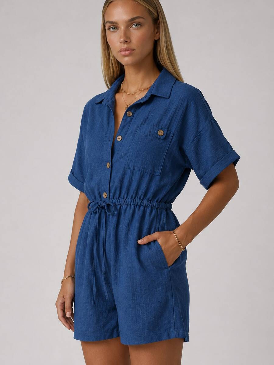Women's Short Sleeve Romper With A Collared Neckline, Button-Front Closure, Chest Pocket, And Adjustable Drawstring Waist. Designed In A Lightweight Woven Fabric For A Comfortable And Versatile Everyday Look. - Navy Blue - View 1