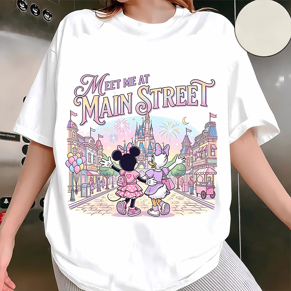 Diseny Minnie & Daisy Meet Me At Main Street Graphic Sweatshirt, Made Of Soft And Thickened Fabric With Cloud-Like Touch, This Crewneck Sweatshirt Features A Sweet Pastel Print Of Minnie Mouse And Daisy Duck Walking Hand In Hand Down Main Street Toward The Magic Castle With Fireworks And Balloons, Decorated With The Quote "Meet Me At Main Street" In Soft Gradient Lettering, Offering A Comfortable Relaxed Fit That Suits Daily Wear, Theme Park Trips, Casual Outings And Girls' Gatherings, Ideal As A Sweet And Thoughtful Gift For Disney Lovers To Add A Touch Of Magic And Warmth To Every Moment. - White - View 1