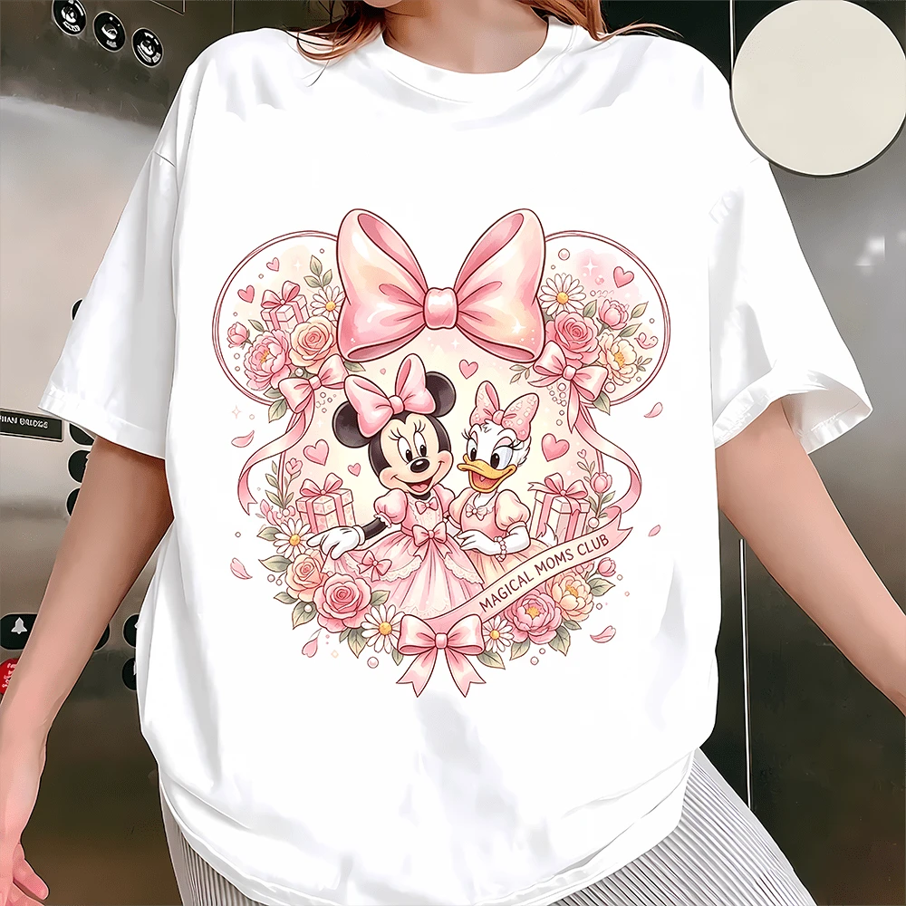 Diseny Minnie & Daisy "Magical Moms Club" Coquette Graphic Sweatshirt, Made Of Soft And Thickened Fabric With Cloud-Like Touch, This Crewneck Sweatshirt Features A Sweet Coquette-Style Print Of Minnie Mouse And Daisy Duck In Elegant Pink Dresses, Framed By A Large Pink Bow And Floral Mickey Ear Outline, Paired With The Quote "Magical Moms Club" On A Ribbon Banner, Offering A Comfortable Relaxed Fit That Suits Daily Wear, Theme Park Trips, Casual Outings And Girls' Gatherings, Ideal As A Sweet And Thoughtful Gift For Disney-Loving Moms To Add Magic And Warmth To Every Moment. - White - View 1