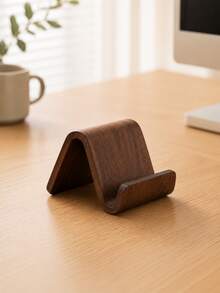 Fabriqué en bois massif de haute qualité avec une texture douce et délicate. La structure en forme de U offre un support stable pour le téléphone, empêchant les glissements et protégeant l'appareil tout en libérant vos mains. - Plusieurs styles - Voir 2