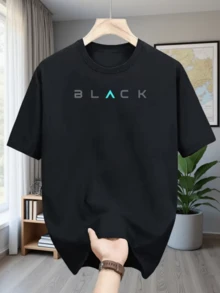 A Word That Highlights Strength And Confidence In Understated Tones With Modern Blue Lettering That Symbolizes Energy And Elegance. A Comfortable, Modern, Casual Men's T-Shirt For Everyday Wear. - Black - View 1