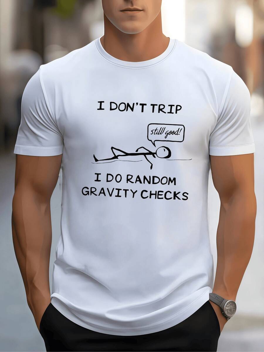 Hombre tumbado en suelo muestra humor al caer probando la gravedad con gracia cómica en esta camiseta de hombre casual con mensaje divertido - Blanco - Ver 1