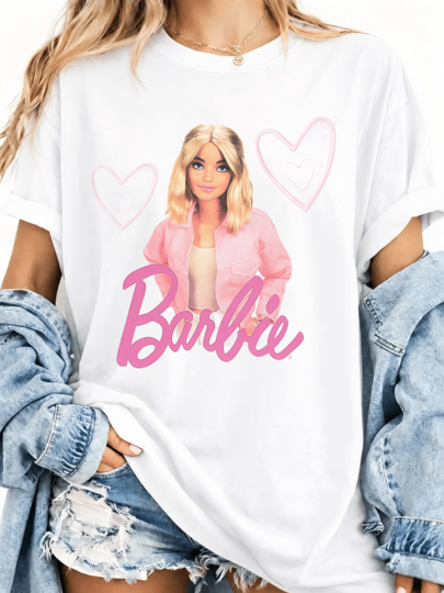 Oversized White Barbieee T-Shirt In A Girly Kawaii Style, Featuring A Portrait Of A Blonde Doll Wearing A Pink Barbieee Cursive Jacket, Unisex Movie Merchandise For Fans Of Soft Aesthetics.