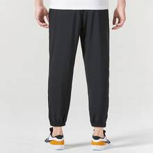 Nike Dri-Fit 品牌Logo印花束腳透氣舒適休閒運動梭織長褲 男款 - 黑色 - 查看 3