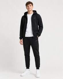Pantalones deportivos de punto Nike de cintura media con cordones y puños, para hombre, color negro - Negro - Ver 6