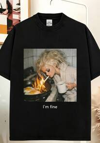 Camiseta estilo vintage/retro de los 90 con un meme humorístico de cara de muñeca, con aspecto desteñido y confeccionada con telas de verano. - Negro - Ver 1