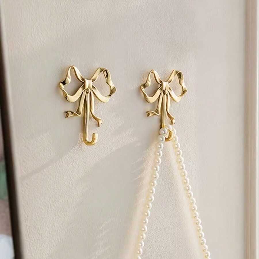 1/2pcs Gold Elegant Bow Metal Wall Hooks, Exquisite Painted Craftsmanship, Sturdy And Durable, No-Drill Convenient Wall Storage, Can Hang Keys, Hats, Clothes, Suitable For Entryway, Living Room, Bedroom, Bathroom, Princess Room Decoration, Simple And Highly Attractive, Home Wall Organization Essential - Multicolor - View 1