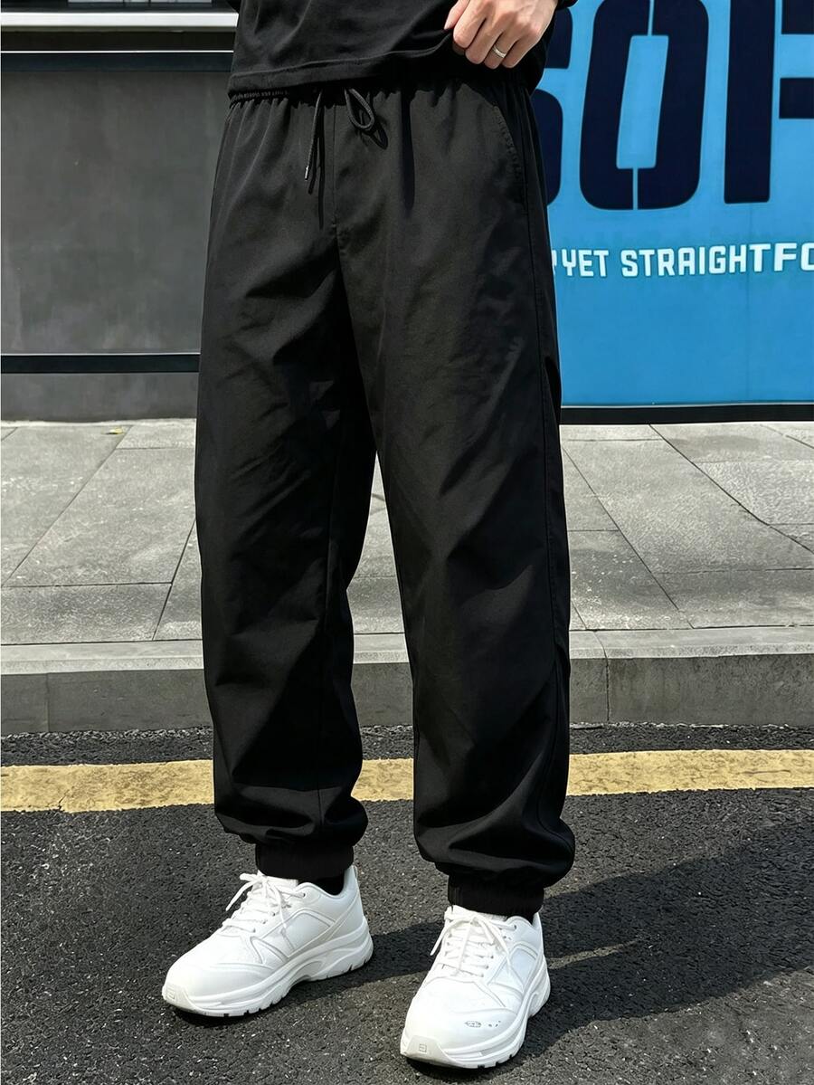 加大码男士宽松黑色长裤,弹性抽绳腰带设计,适合运动、露营、徒步旅行等各种活动。 - 黑色 - 查看 1