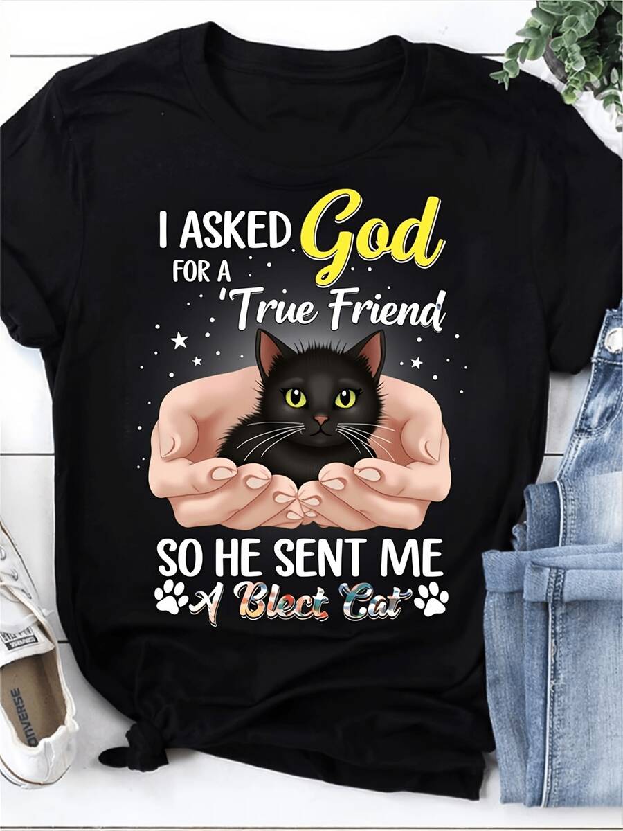 Camiseta Divertida para Entusiastas de los Gatos. Pedí un Verdadero Amigo a Dios y Me Regaló un Gato Negro. Presenta una Frase Cautivadora y un Diseño de Gatito. Hecha de Tela Casual con Cue - Negro - Ver 1