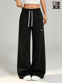 mulinsen Women's Straight Leg Wide Leg Sweatpants, Colorblock White Drawstring Side Pockets Small Logo Center Seam Slit Draped Floor-Length Straight Pants - Black - View 1