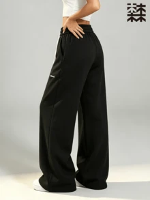 mulinsen Women's Straight Leg Wide Leg Sweatpants, Colorblock White Drawstring Side Pockets Small Logo Center Seam Slit Draped Floor-Length Straight Pants - Black - View 3