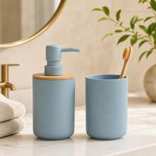 This 2 Pieces Bathroom Accessory Set Creates A More And Coordinated Visual Effect For Your Sink Area. The Set Includes A Refillable Pump Soap Dispenser And A Matching Open-Top Rinse Cup, Both In A Soft Grey-Blue Tone. The Soap Dispenser Features A Natural Bamboo Lid For A Warm Visual Contrast, And The Smooth ABS Material Body Gives The Overall Design A Minimalist, Fresh, And Modern Look. The Soap Dispenser Can Hold Hand Soap Or Hand Lotion. - Blue - View 2