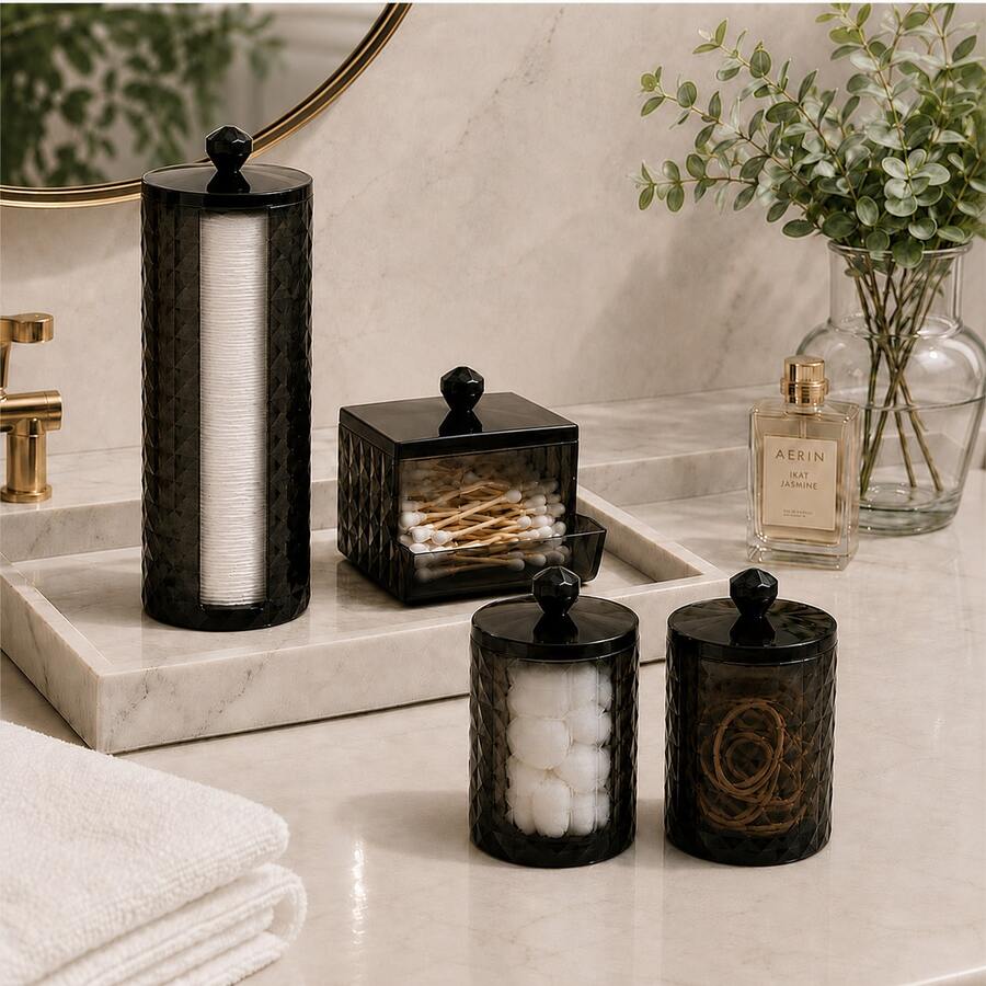 This 4-Piece Set Of Smoky Black Acrylic Storage Containers Brings An Organized And Tidy Storage Experience To Your Bathroom Countertop. The Set Includes One Tall Cotton Pad Holder, One Square Cotton Swab Holder With A Front Opening, And Two Matching Round Lidded Storage Jars. The Semi-Transparent Body Allows For Easy Identification Of Stored Items, And The Lids Feature A Three-Dimensional Diamond Texture And Faceted Knob Design - View 1