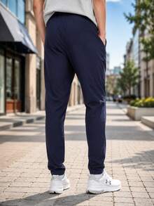 Under Armour Men's Icon Legacy Windbkr Pants, Woven Straight Leg Single Layer Travel Running Pants 1382876-410 - Blue - View 3