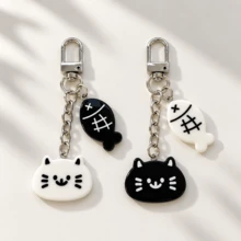 1pc/2pcs Unisex Black & White Cartoon Cat Eating Fish Pendant, Black & White Small Fish Accessory Keychain, Cute Couple Bag Charm, Luggage Accessory - Black and White - View 1