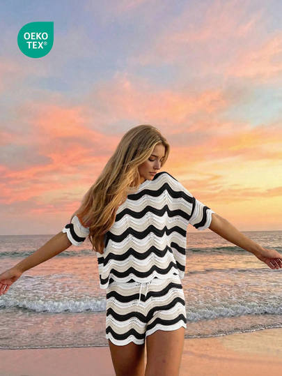 Conjunto de dos piezas de top de manga corta con tejido de ganchillo hueco y shorts casuales, estilo europeo y americano de moda para mujer en primavera y verano